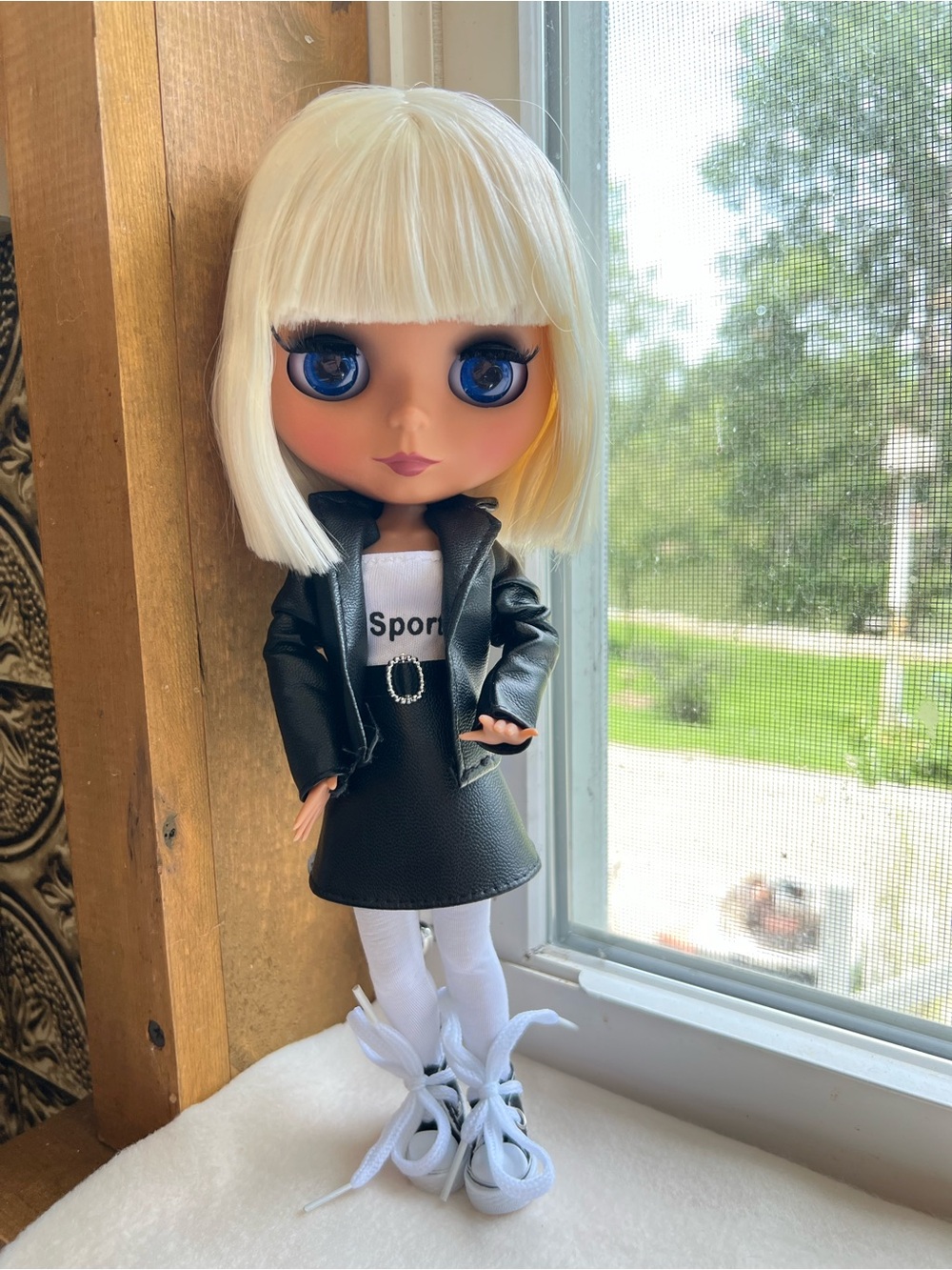 ICY DBS Certified Blythe blonde doll, bob haircut, and black faux leather outfit